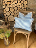 Pompom cushion with feather insert